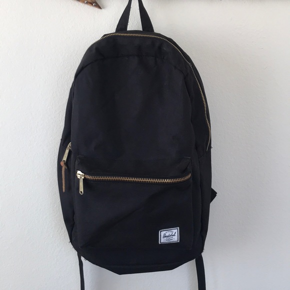 HERSCHEL black and gold backpack great condition